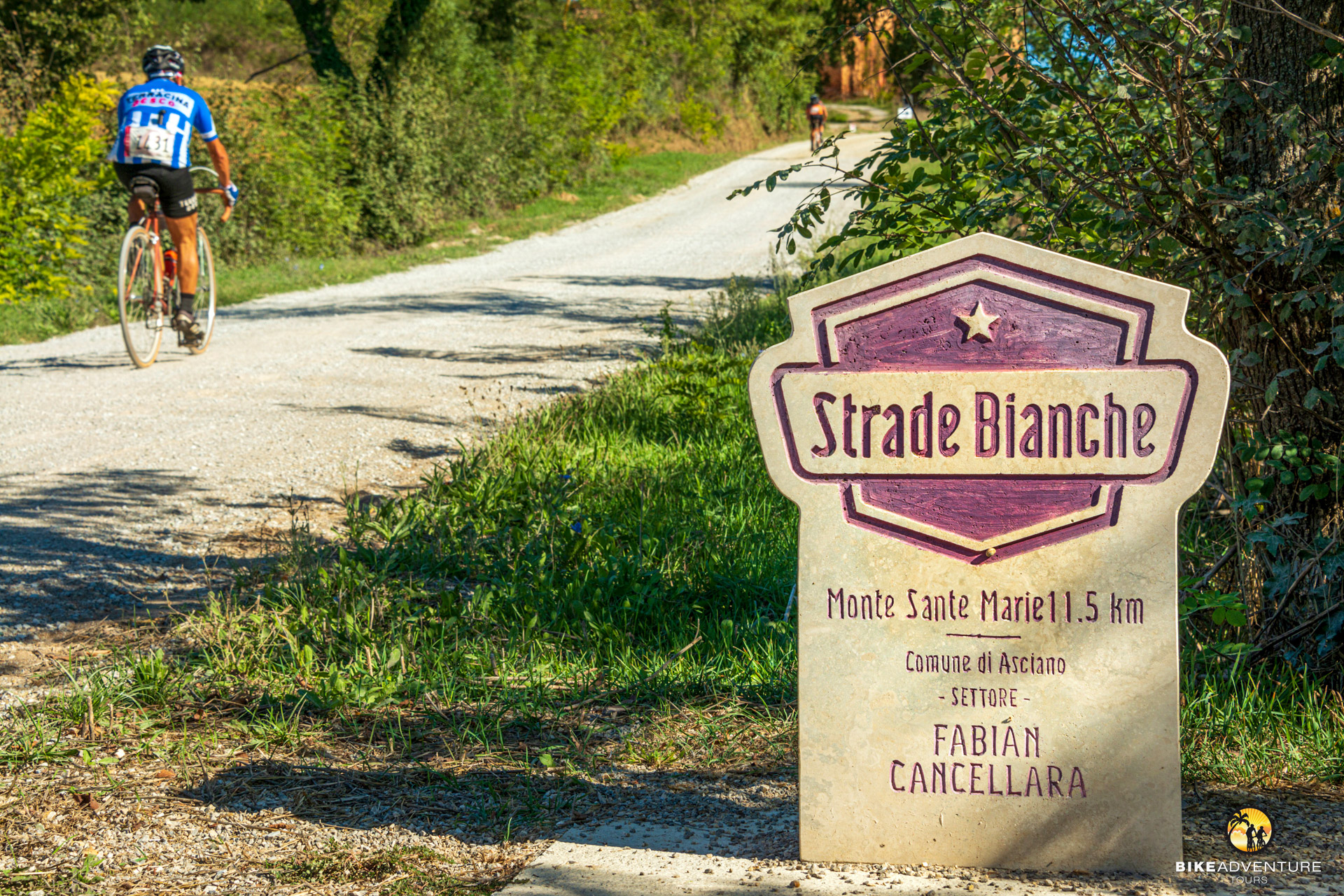 monumental road sign at the beginning of the Monte Sante Marie c Toskana Gravelbike Tour